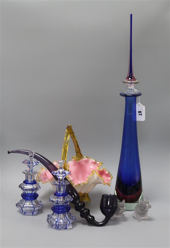 A pair of glass scent bottles, a glass spire shaped decanter, a glass pipe, a pair of glass bulldogs and a decanter height 58cm